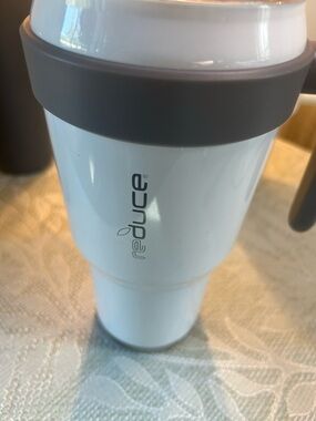 Reduce White Travel Mug with Gray Grip